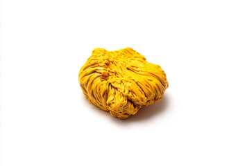 A close-up shot of a vibrant yellow, textured, dried root on a clean white background, resembling turmeric.