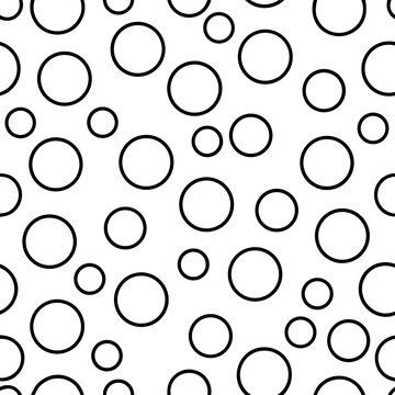 Title: Pattern of various sized circles with thick black outlines on a white background