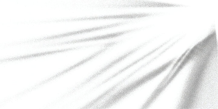 Abstract minimalist background with white light rays shining over a grainy, folded surface
