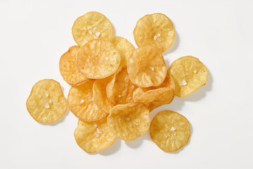 Golden Crispy Potato Chips Isolated on White Background