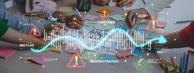 Business team collaborates on strategy analysis with data charts and alerts using colorful sticky notes, enhancing teamwork and visualization in a modern office setting. Trope