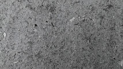 Grainy grey particle texture abstract background with dark speckled style