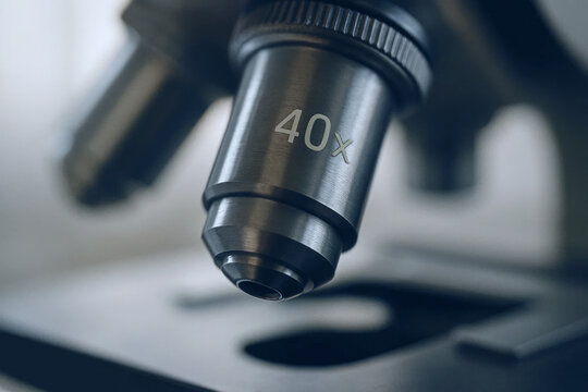 Close up view of microscope objective lens showing 40x magnification in laboratory setting