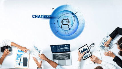 Diverse team members analyze digital data in a collaborative workspace with a chatbot interface, emphasizing technology role in modern business and communication. Trope