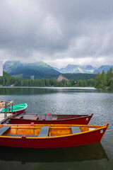 Fototapeta premium Rowboats waiting at Strbske Pleso lake, High Tatras
