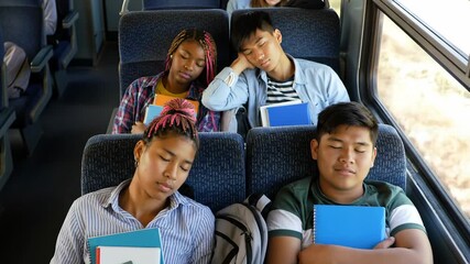 Diverse group of students sleeping on train with books, travel and education theme - Powered by Adobe