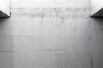 Minimalist concrete wall texture with subtle lighting and rough surface