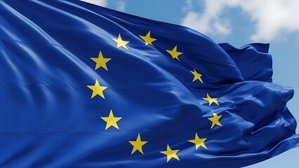 Waving flag of the european union against a blue sky with clouds