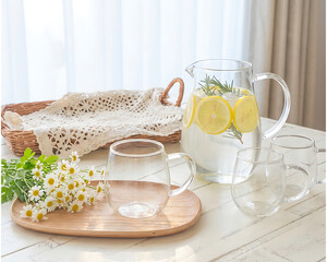 Fresh Lemon and Rosemary Infused Water in Glass Pitcher, Natural Detox Drink