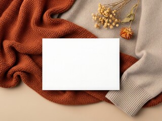 Cozy autumnal scene with blank card and dried flowers