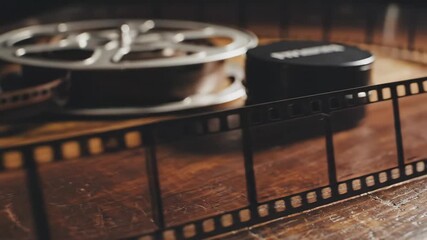 Film Reel on Wooden Surface Closeup.