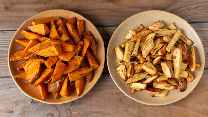 Sweet potatoes and parsnips roasted with honey and thyme: sweet potatoes on one plate, and parsnips on another. 