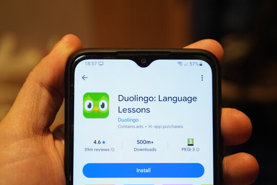 Duolingo language learning app displayed on a smartphone screen held by a hand