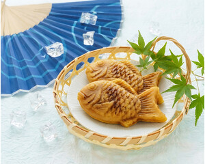 Japanese Taiyaki Fish-Shaped Sweet Cake in Bamboo Basket, Summer Dessert Concept