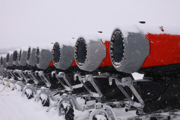 Row of Snow Cannons Covered in Winter Snow.Snow making