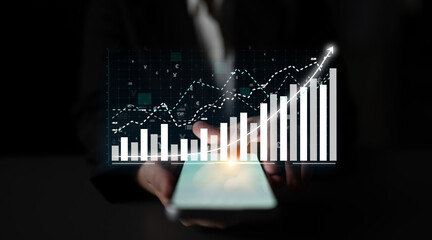 A businessperson holds a smartphone showcasing a vibrant financial growth chart, symbolizing success and analytics in modern finance and technology environments. Impute