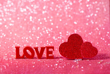 Red Love Hearts and Love Letter Decoration on Glitter Background. The Valentines Day concept perfect for holiday designs, greeting cards, and advertising.