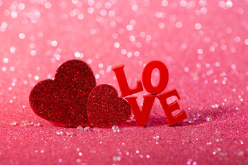 Red Love Hearts and Love Letter Decoration on Glitter Background. The Valentines Day concept perfect for holiday designs, greeting cards, and advertising.