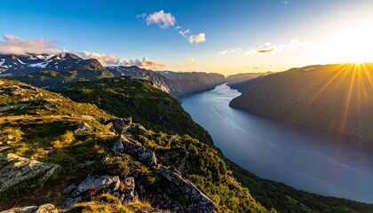 Deep blue fjord winding through forested cliffs and snowy peaks showcasing natural grandeur and Nordic serenity