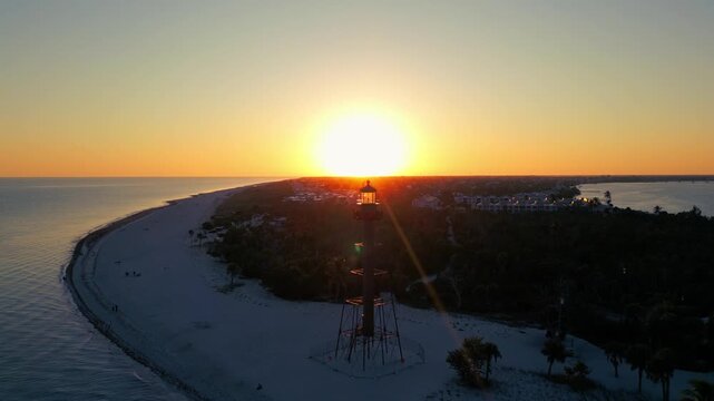 light rays and sunset behind lighthouse in florida 