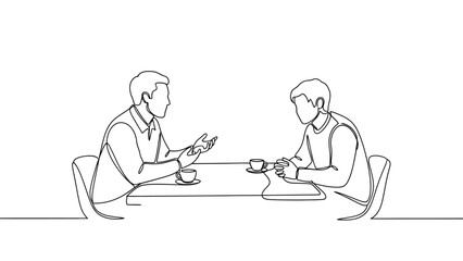 Two people having a conversation while seated at a table with coffee