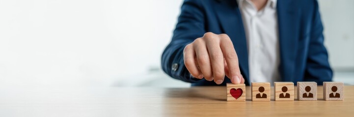 Empathy in leadership concept. Wooden block symbolizing empathy and partnership among blocks representing individuals, emotional intelligence and trust in workplace leadership and team collaboration.