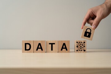 Data protection and digital security concept. Wooden blocks with text DATA and padlock icon. Data protection, privacy, cybersecurity, secure networks, encryption and safeguarding information. 