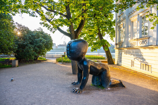 PRAGUE, CZECHIA - JUNE 18, 2025: The Babies at Kampa sculptures three large, faceless, crawling baby sculptures by Czech artist David Cerny, located in Kampa Park in Prague