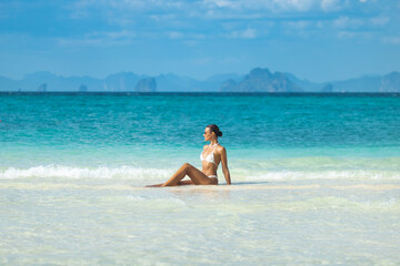 Elegant Woman Relaxing On Bamboo Island Beach In Phi Phi Archipelago, Thailand