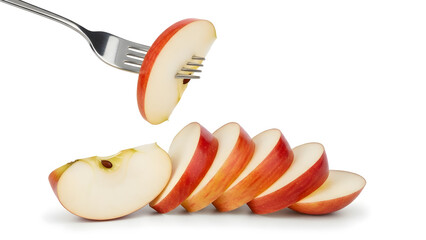 Sliced red apple on a fork fresh fruit arranged in a row healthy food concept for diet and nutrition isolated on white