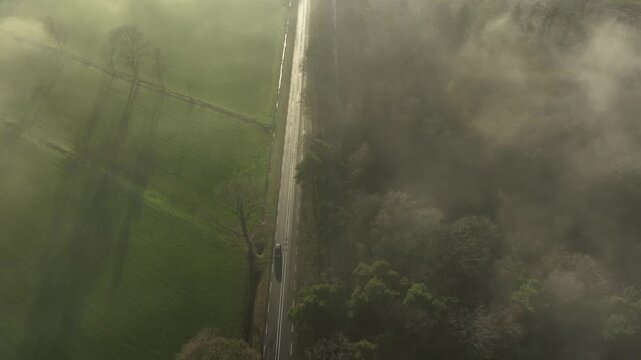 aerial footage of a highway in the Netherlands partly covered in mist