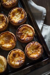 Portuguese Custard Egg Tarts : A close-up, top-down view of pastel de nata