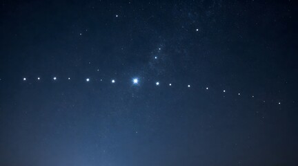 View of starlink satellite train passing overhead in the night sky