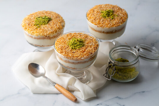 A traditional milk-based Ramadan dessert: fried kadayıf (shredded phyllo dough) and custard with sliced ​​pistachios. Kadaf&icirc; Muhallebi