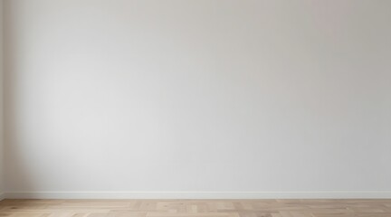 Naklejka premium Clean white wall and light wood floor are visible in an empty room