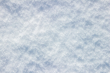 Fluffy snow lies on a flat surface. Top View.