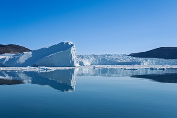 Iceberg Reflections in Front of Eqi Glacier, Disko Bay, Greenland © Michel