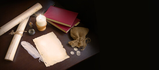 Paper and quill on the table