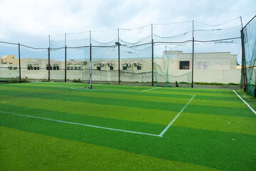 outdoors green playground for mini football in an Omani village © max5128