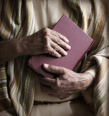 Old man holding a book