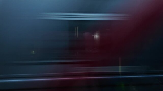 A blurred image of a train passing a moving train