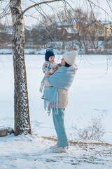 Portrait of Mother and Baby in Winter Wonderland