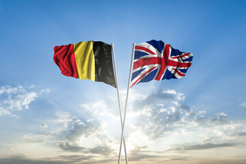Waving National flag of Belgium and flag of United Kingdom