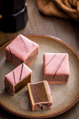 Sweet dessert cake. Mini pie on plate on wooden table.
