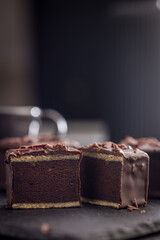 Sweet dessert cake. Mini pie on black table.