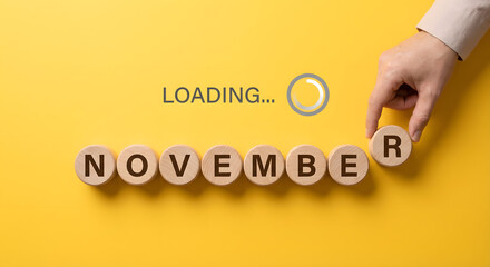 November month loading concept with wooden letters