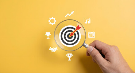 Business target concept with magnifying glass