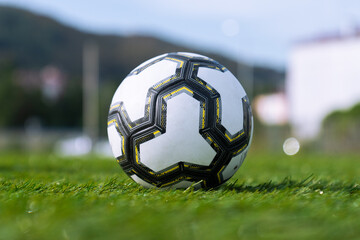 Close-up soccer ball on green grass. Close-up of a soccer ball on a green soccer field.
