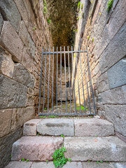 Roman Ruins of Trajaneum: Vaulted Corridor with Iron Gate in Pergamon