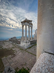 Behold the Columns of Trajan's Temple of Attalid Dynasty amidst Pergamon's Dramatic Hilltop Skies